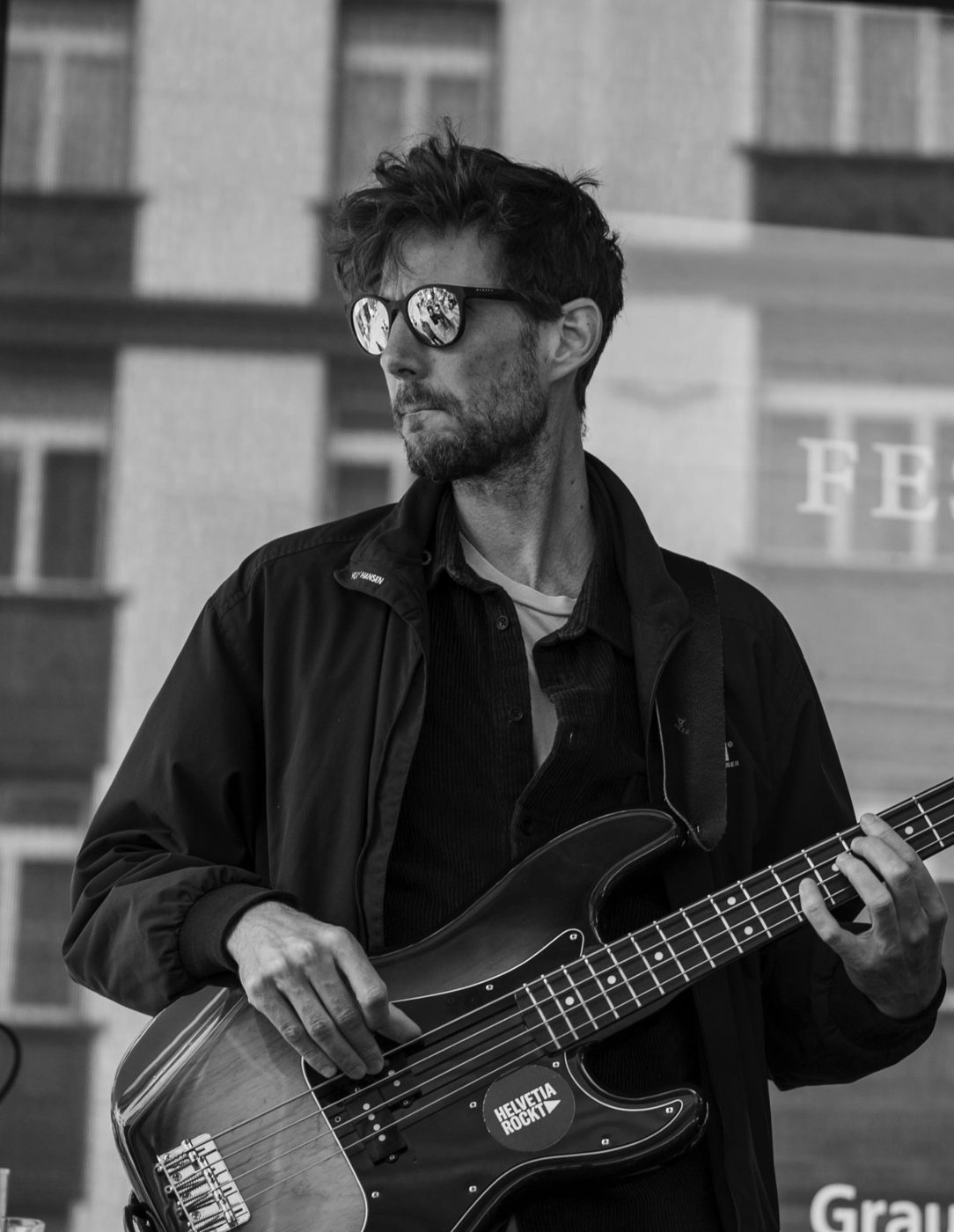 Florian Egli playing bass, black and white photo